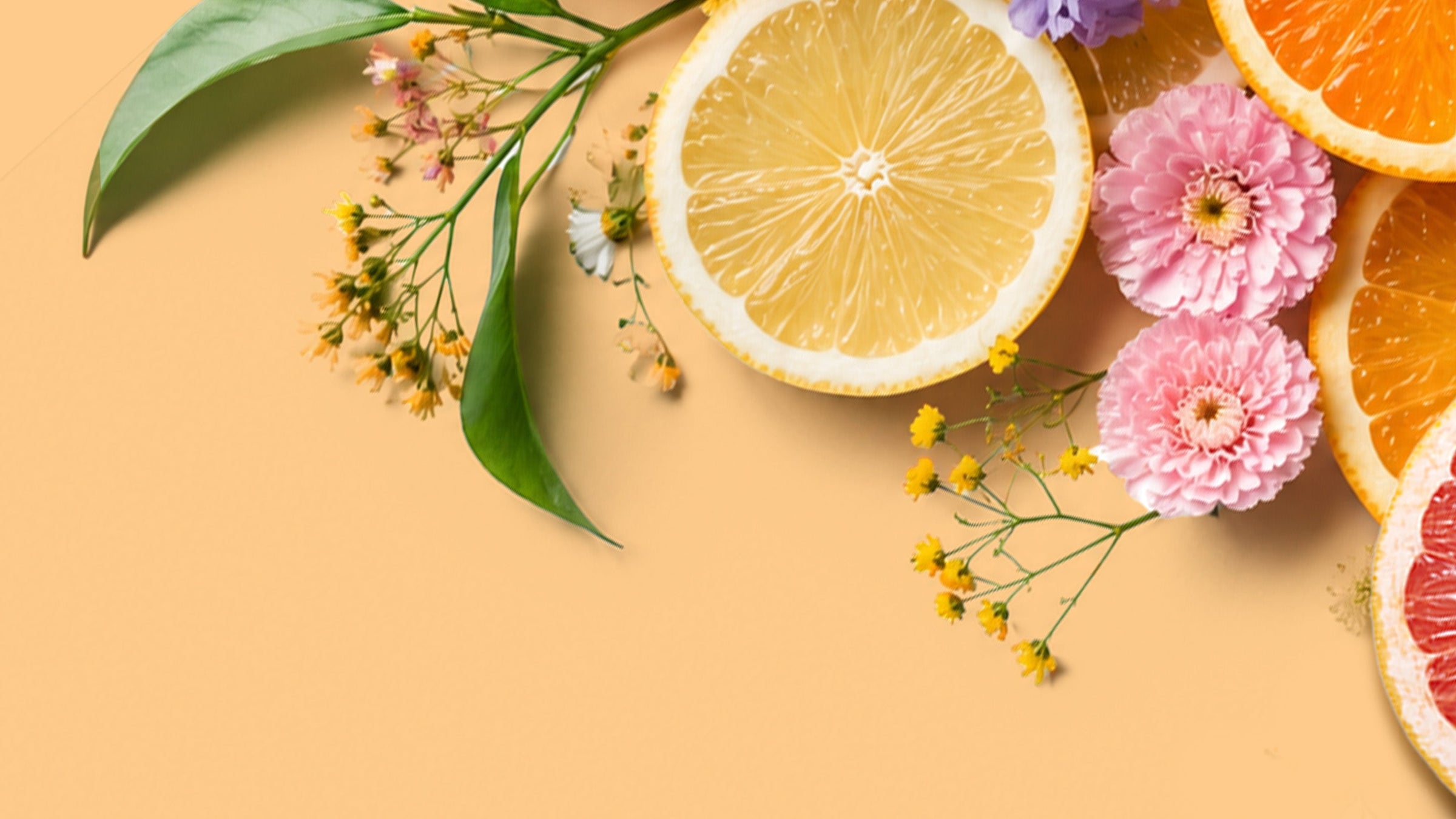 A group shot of products that are recommended for Springtime in a basket, surrounded by flowers in a picnic setting. 