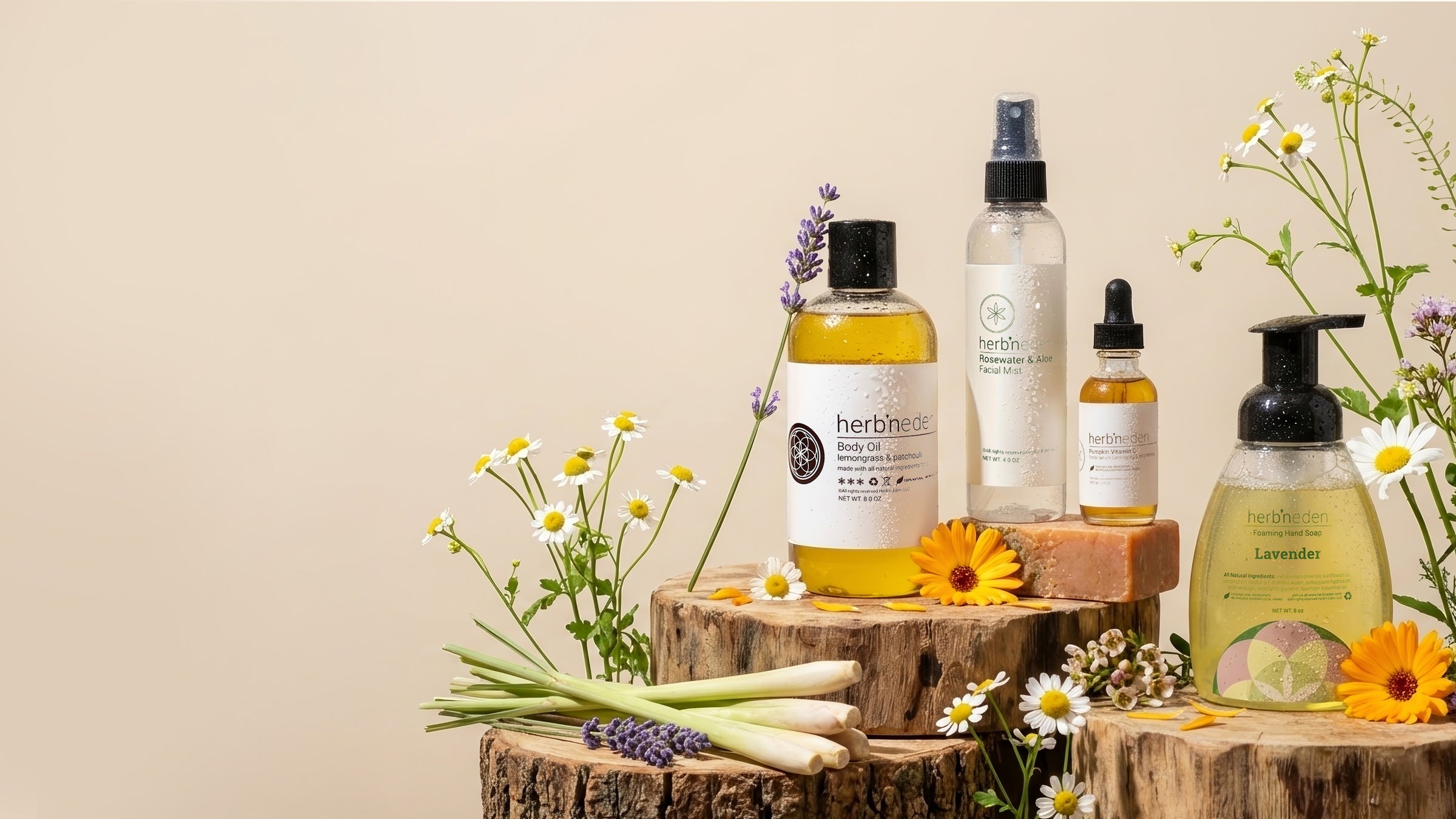 Herbivore Botanicals skincare products on a wooden surface with flowers